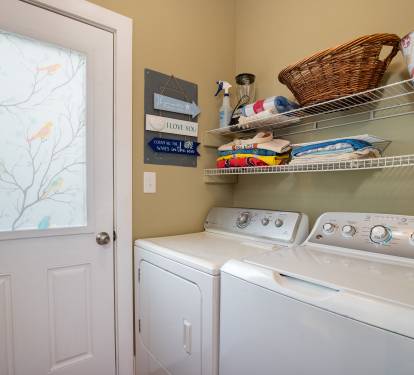 Laundry room located just off the kitchen.