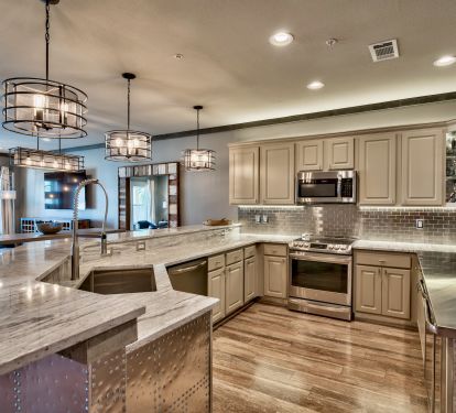 Kitchen w/ 70 inch tv, stainless prep counter, 2 beverage coolers, LED lighting