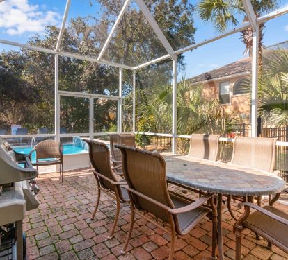 Dining outside in the lanai with a gas grill for cooking