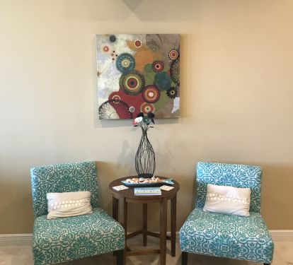 Accent chairs at the top of the stairs. Please sign the guest book here. 