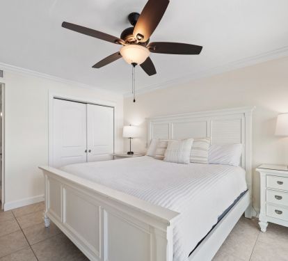 Master bedroom features comfortable king size bed.