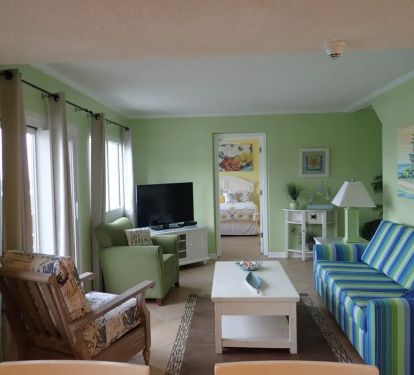 Living Room with sleeper sofa and view of Queen Bedroom