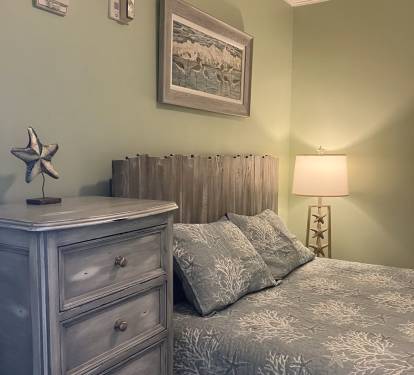 Second bedroom featuring queen bed.