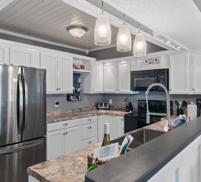 New appliances in completely furnished kitchen