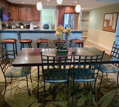 Dining Area &amp; Kitchen Bar Area with a TV