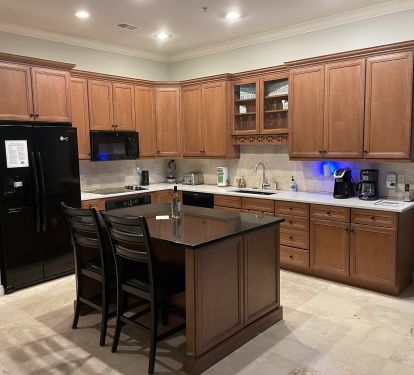 Kitchen has island, drink frig and all the amenities. 