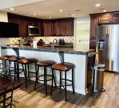 Kitchen Bar Area with a TV