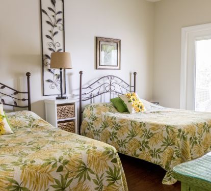 second floor bedroom with 2 QUEEN beds and door to oversized porch 