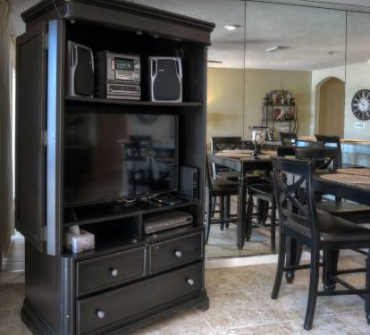 View of amoire with TV and other equipment
