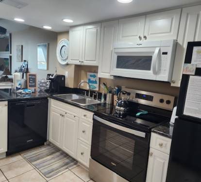 Kitchen with new stove &amp; microwave