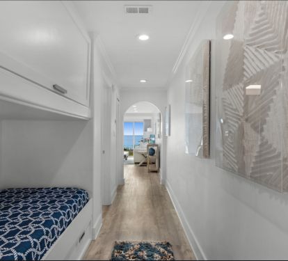 Hall bunk area with trundle, storage space above