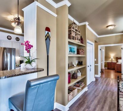 Hallway leading to master bedroom, bunk room, 1/2 bath, and laundry room.