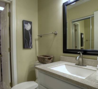 Door leads into shower/laundry room from master bedroom's half bath