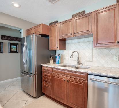 Beautiful, spacious kitchen with stainless steel appliances.