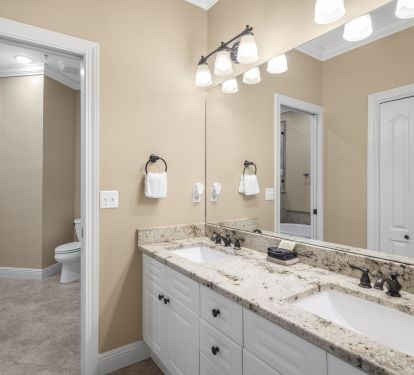 Master bath has separate vanity, bathing areas