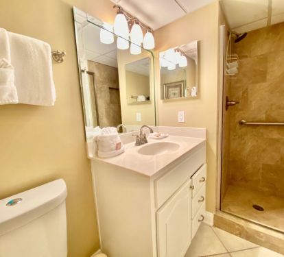 Hall bathroom with tile shower 
