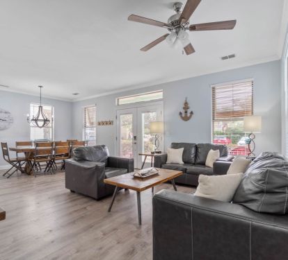 First floor living room with dining table in background