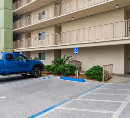 Handicap parking, no curb to front door on right side of photo, ground floor.