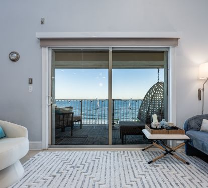 Bright, open living space with direct access to your private balcony and uninterrupted Gulf views.