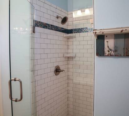 Newly tiled subway shower on main level