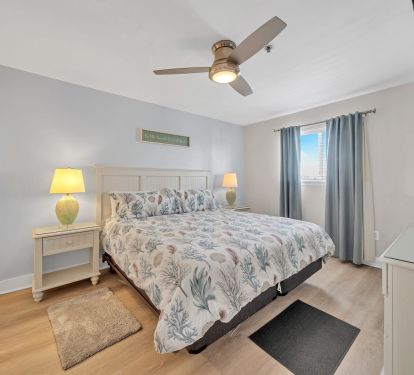 Master bedroom with king bed, smart TV and master bathroom
