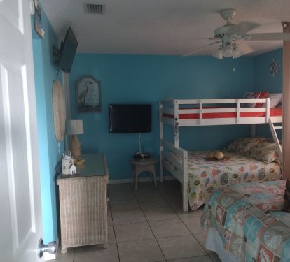 Bedroom with gaming station for kids to bring their gaming equipment.