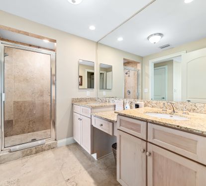 Double vanity sinks in master bathroom, with separation countertop area