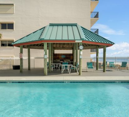 Two Gas Grills under Pavilion by east end pool 