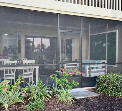 Serene, Screened-in Patio with Daybed Swing and Dining Table