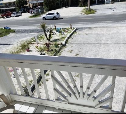 Private Balcony out of second master on main level. Faces the street.