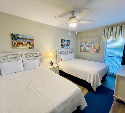 Two new Queen beds are in the second bedroom with shared bathroom.