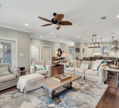 Living room with comfortable couches and roomy chairs.