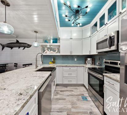 Beautiful coastal kitchen highlighted with stainless steel appliances 