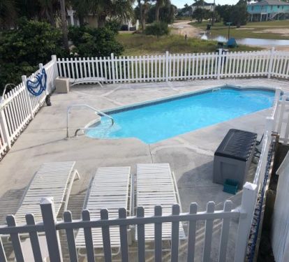 Inground swimming pool with plenty of seating