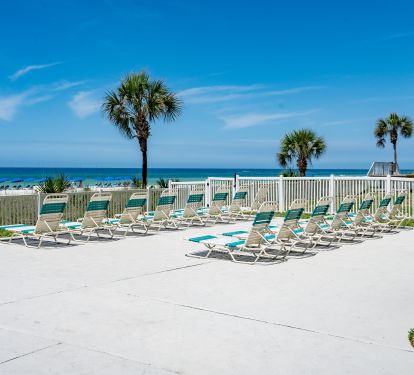 Plenty of chairs at pool and 2 reserved chairs w/umbrella on beach.
