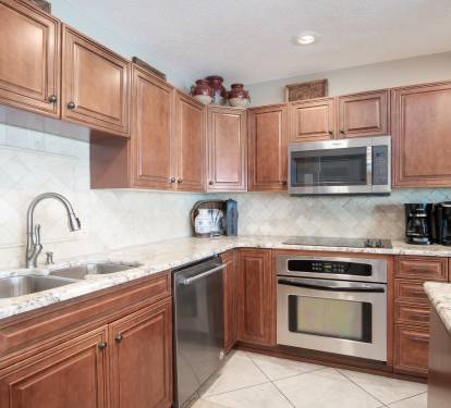 Open, spacious kitchen is well-equipped with everything to prepare any meal.