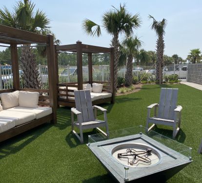 Relax in the cushioned lounges as the kiddos roast s'mores in the fire pit!