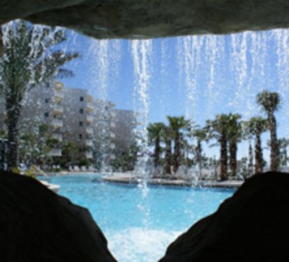 Waterfall in middle pool, that is 1 of 3 pools and 2 spas! Grills are in courtyd.