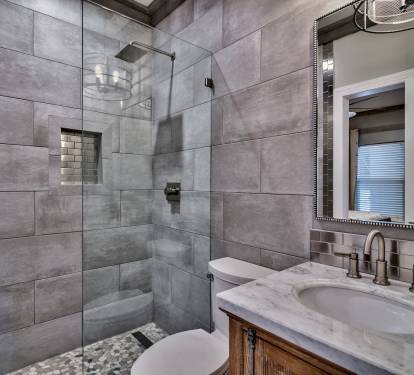 Guest bathroom with walk-in shower, rain head, and seamless glass