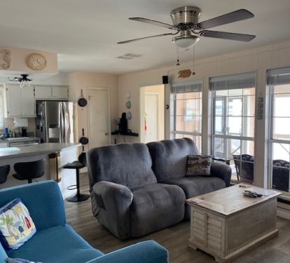 living room with comfy recliner and view of the bay.