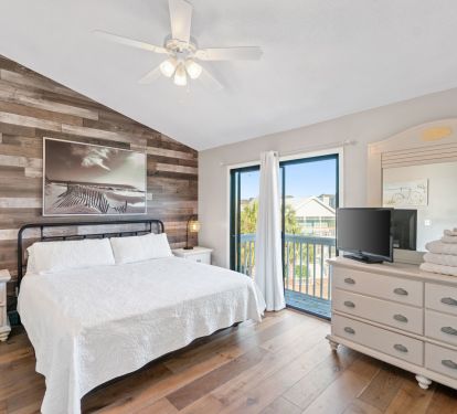 King bed with balcony that overlooks playground and front yard 