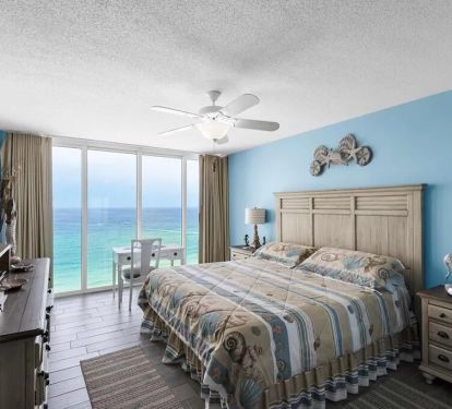 Bedroom One with Sun, Sky and water view
