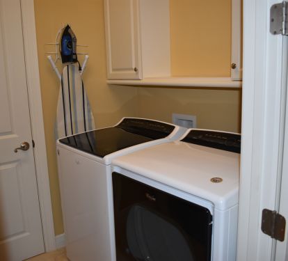 Full size washer and dryer on the upper floor between bedrooms.
