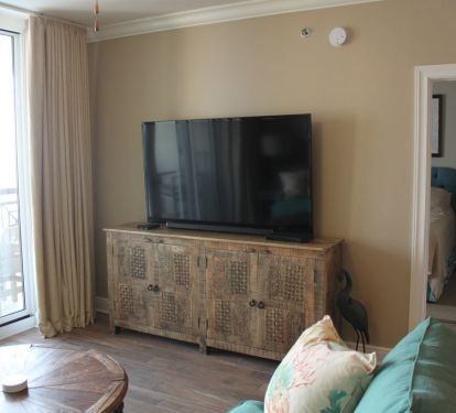 Huge 65 inch Samsung TV. An HDMI cable is provided for connecting a laptop