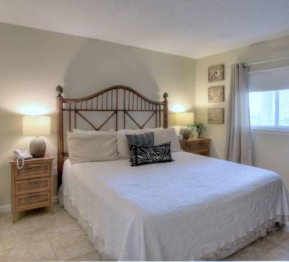King bed in master bedroom with TV