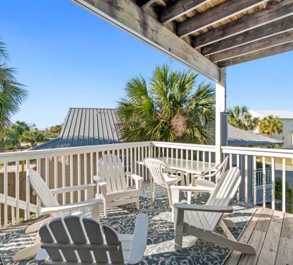 Back porch off living room. There's plenty of seating and a propane grill