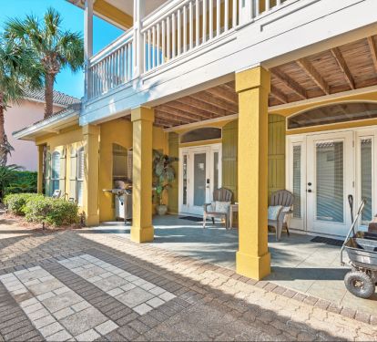 Covered porch with gas grill and beach wagon