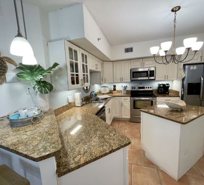 Spacious kitchen with full size fridge and lots of counter space