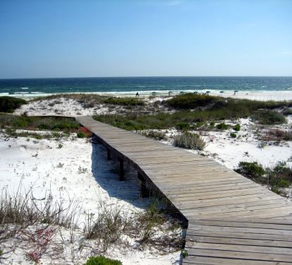 Boardwalk to private beach. Access is ramped; has no steps!