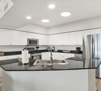 Large fully stocked kitchen and a separate pantry for groceries.